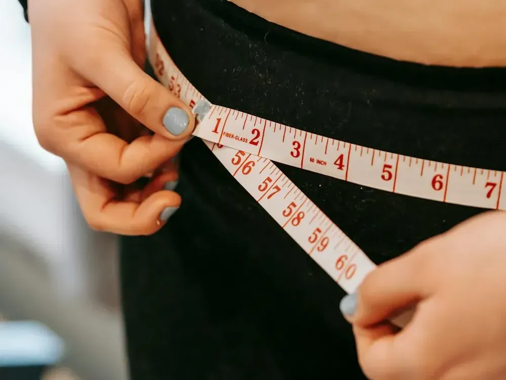 Measuring tape around a waist for a weight loss program
