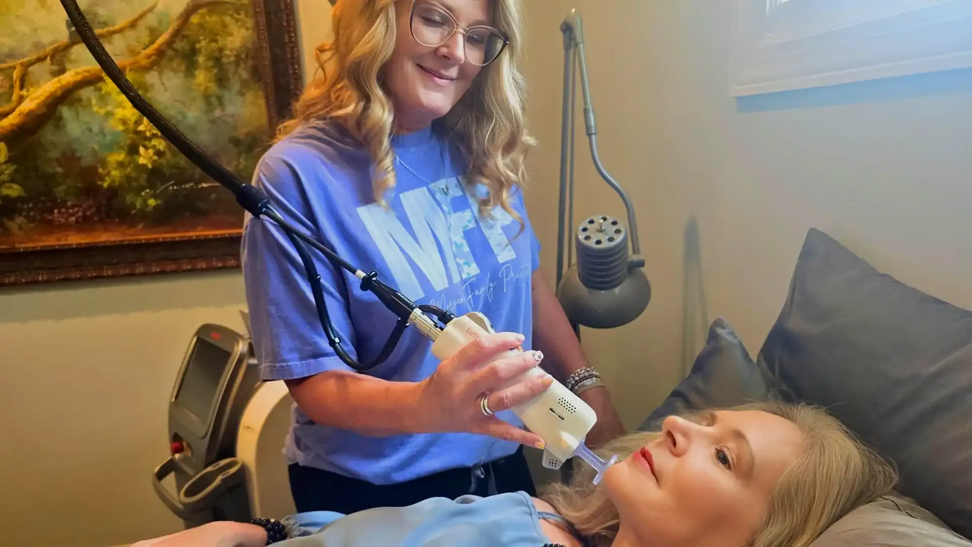 Team member performing a SkinPen microneedling treatment