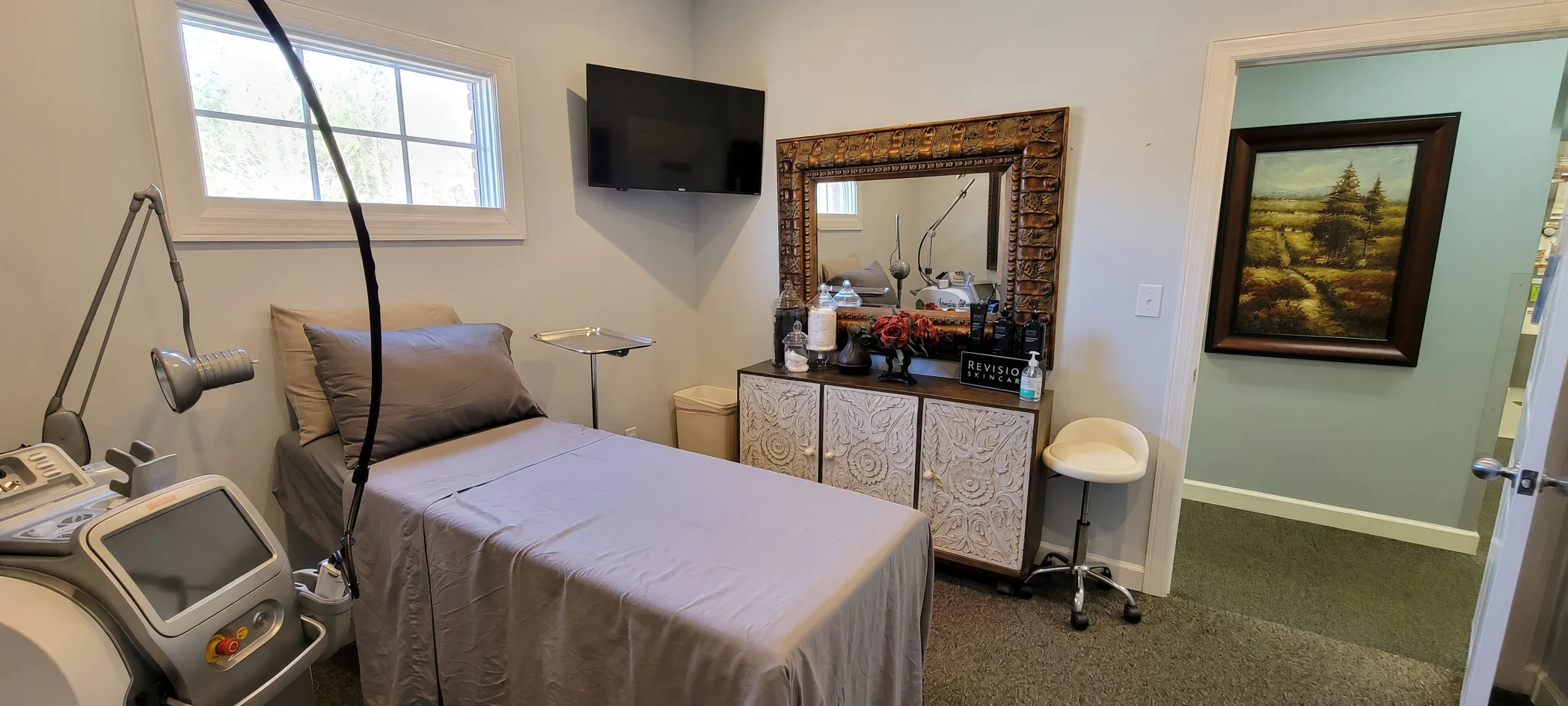 Team member performing a SkinPen microneedling treatment